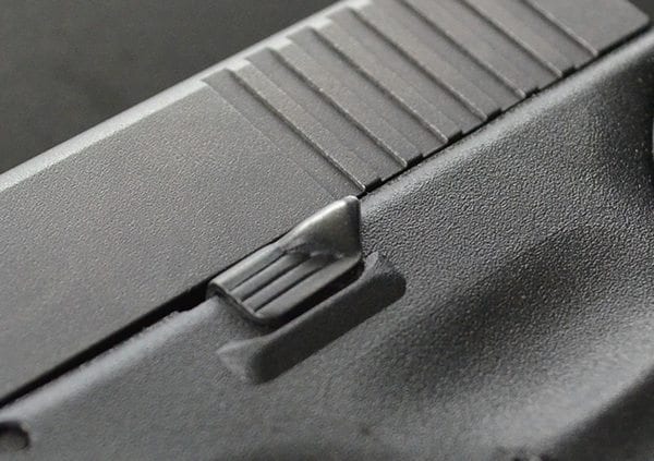 Кнопка сброса затворной задержки пистолета Glock
